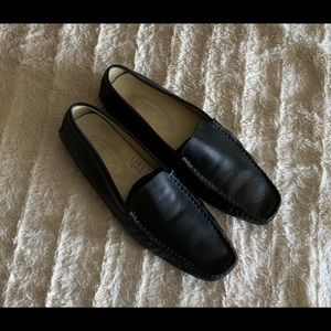 Tod’s black leather driving moc.